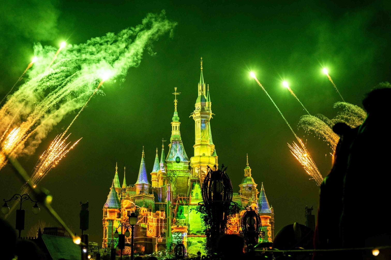 Disneyland castle illuminated at night in Shanghai, China