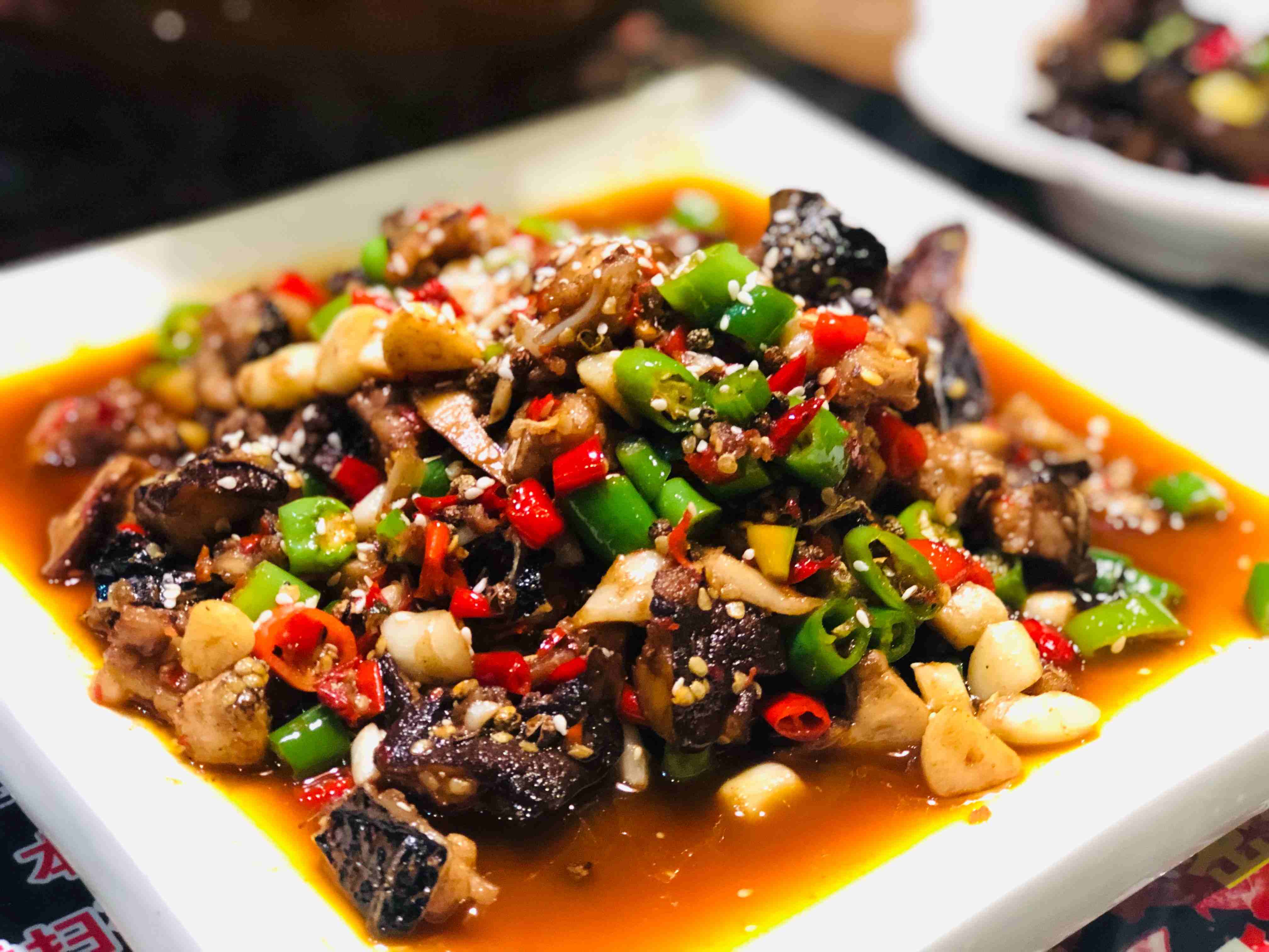Sichuan cuisine with chili peppers and bold flavors, China