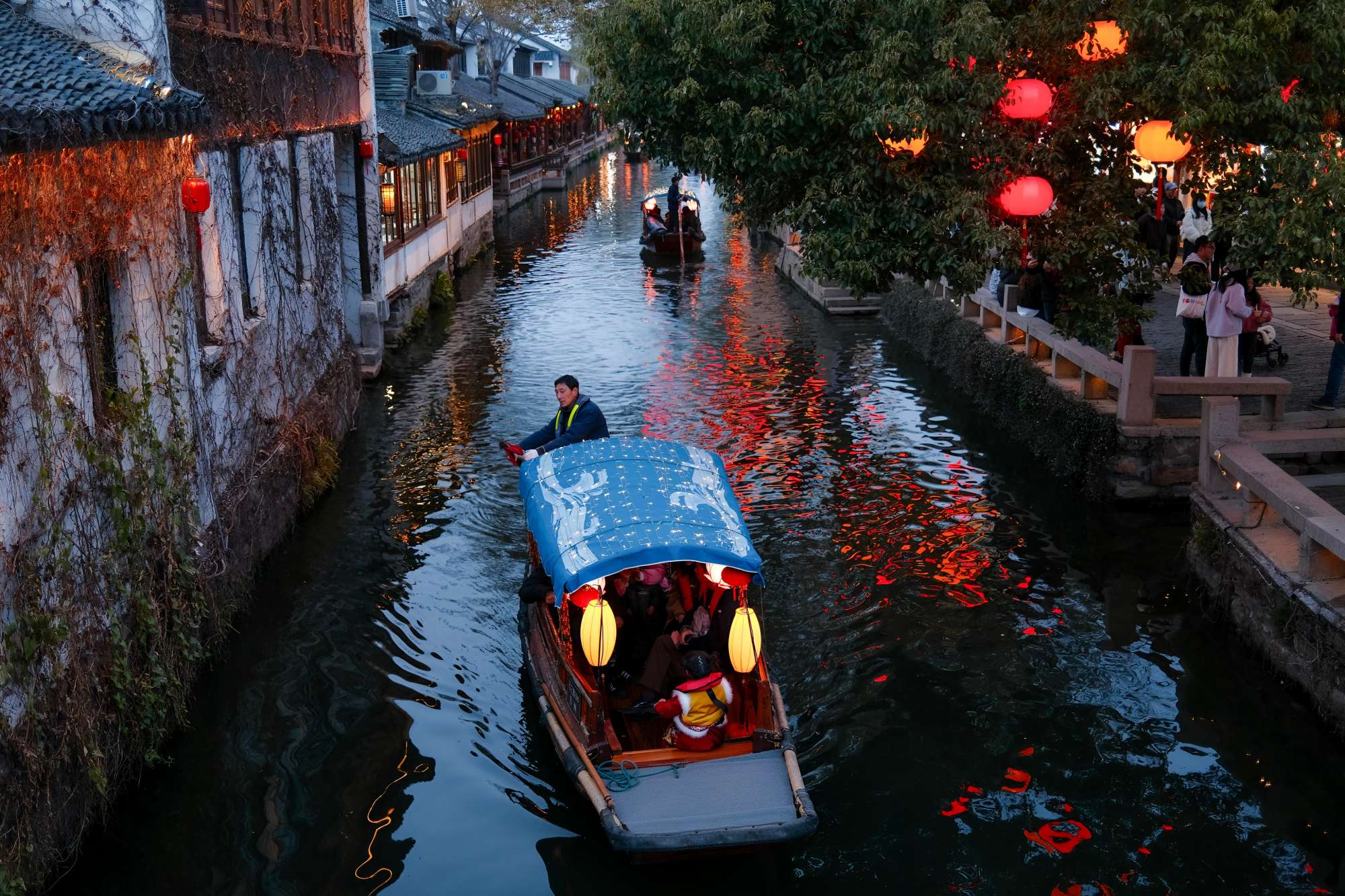 Ancient water town with wooden houses and canal boats in Wuzhen, China